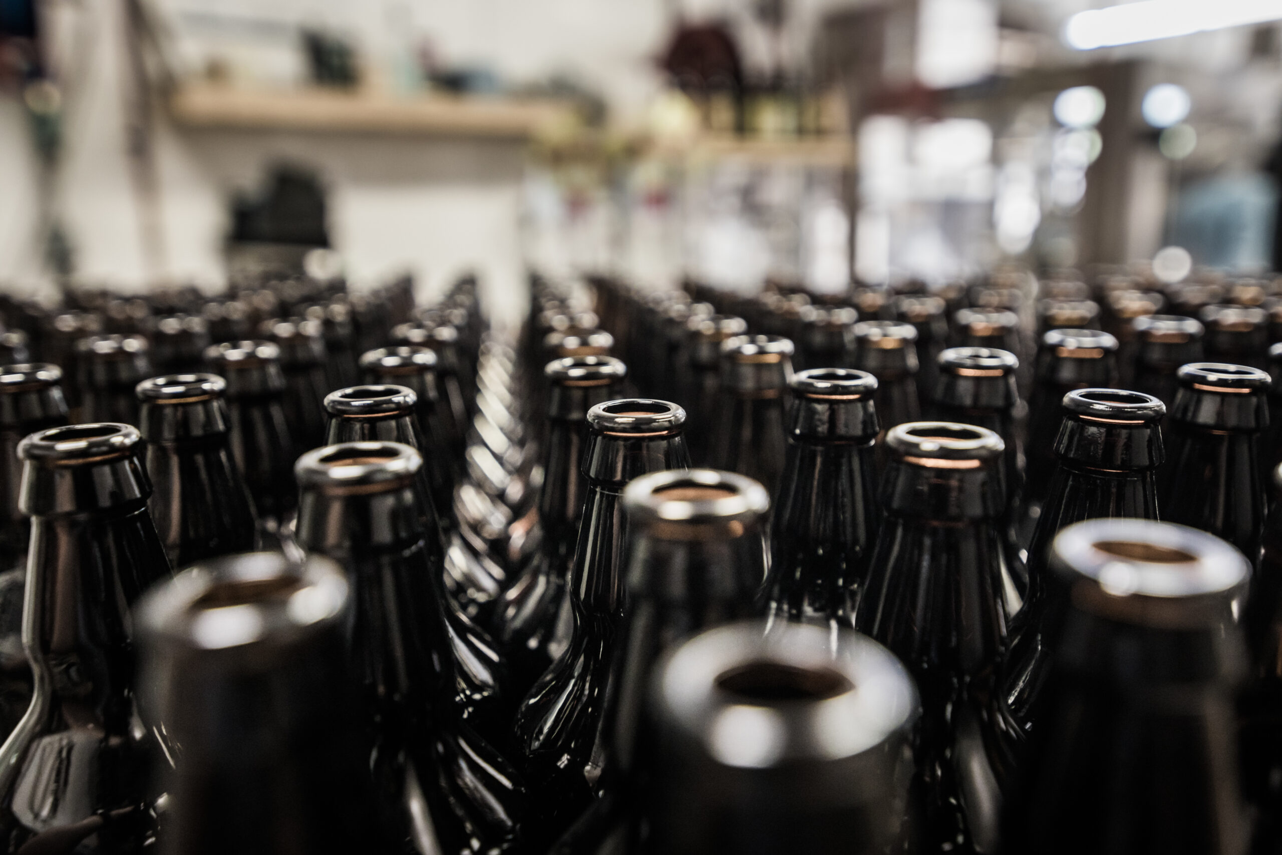 Glass bottles stored and being prepared for bottling